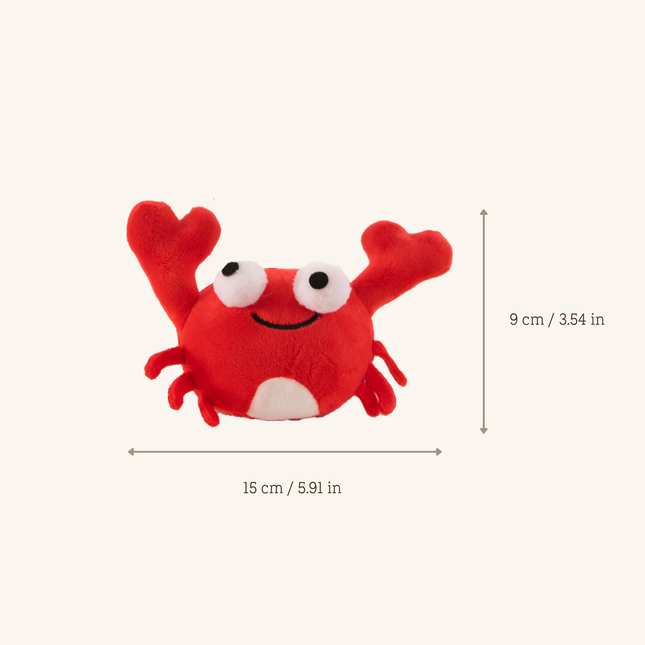 Red plush crab toy with white eyes and a white belly, shown on a light beige background with dimension arrows and text indicating 15 cm width and 9 cm height.