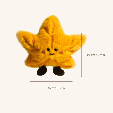 A yellow plush star toy with a cute embroidered face and small black feet, shown on a light beige background with dimension arrows and text indicating 9 cm width and 9.5 cm height.