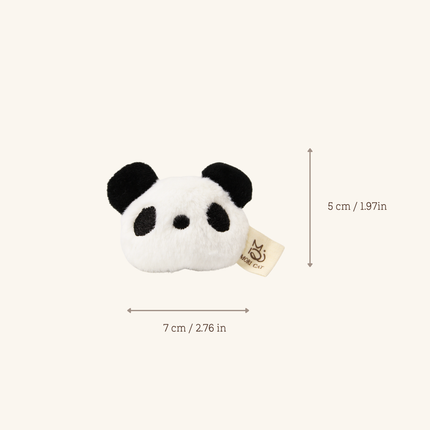 A small panda plush toy with black ears, eyes, and nose on a white face, shown on a light beige background with dimension arrows indicating 7 cm wide by 5 cm tall.