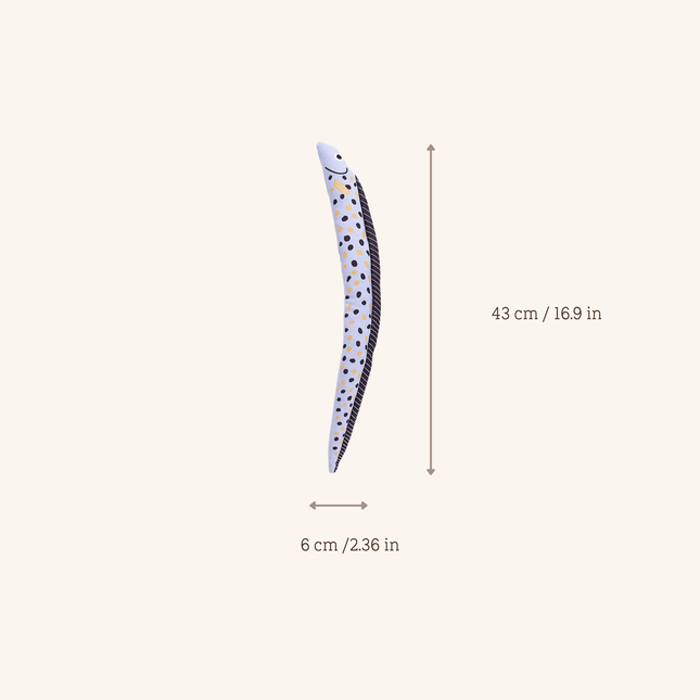 A slim, curved decorative item with a white base and black polka dots, shown with measurement arrows and labels indicating 43 cm in height and 6 cm in width on a plain light beige background.