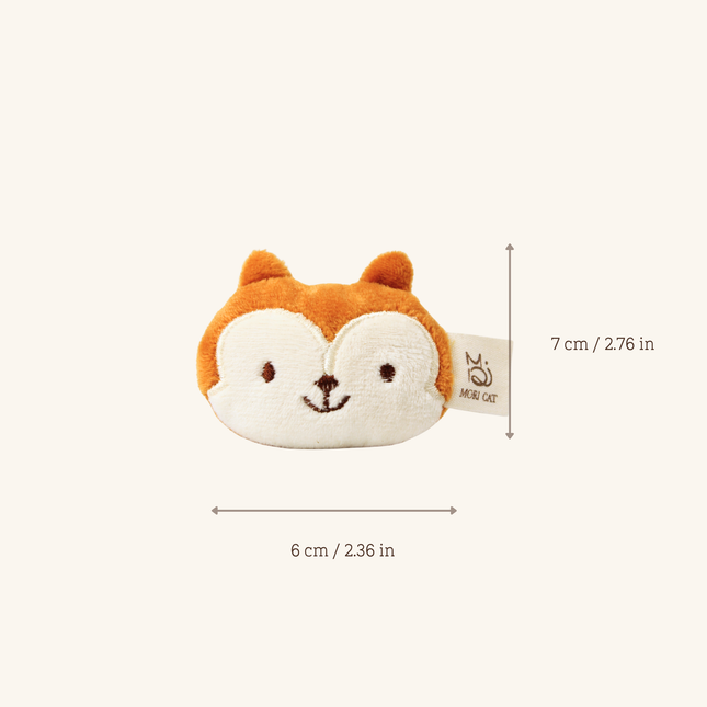 A small plush fox-face pouch shown on a light cream background with dimension arrows and text indicating 6 cm wide by 7 cm tall, plus a visible HABA OZ tag.