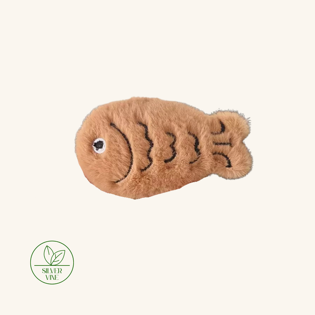 A plush brown fish-shaped pet toy with black embroidered scale details and a white eye, shown on a light cream background with a Silver Vine brand logo in the bottom-left corner.
