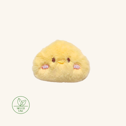 A yellow fluffy plush pouch shaped like a cute chick face, shown on a plain off-white background with a green 'SILVER VINE' brand logo in the bottom-left corner.