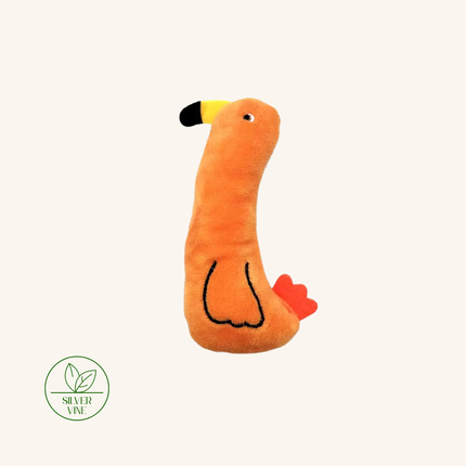 An orange plush bird toy with a yellow and black beak, black stitched body outline, and red tail feathers, centered on a light cream background. A green 'Silver Vine' brand logo is visible in the bottom-left corner.