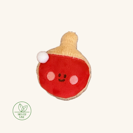 A plush red and beige gourd-shaped toy with a smiling face, pink cheeks, and a small white pom-pom, shown on a plain light background with a Silver Vine logo in the lower-left corner.